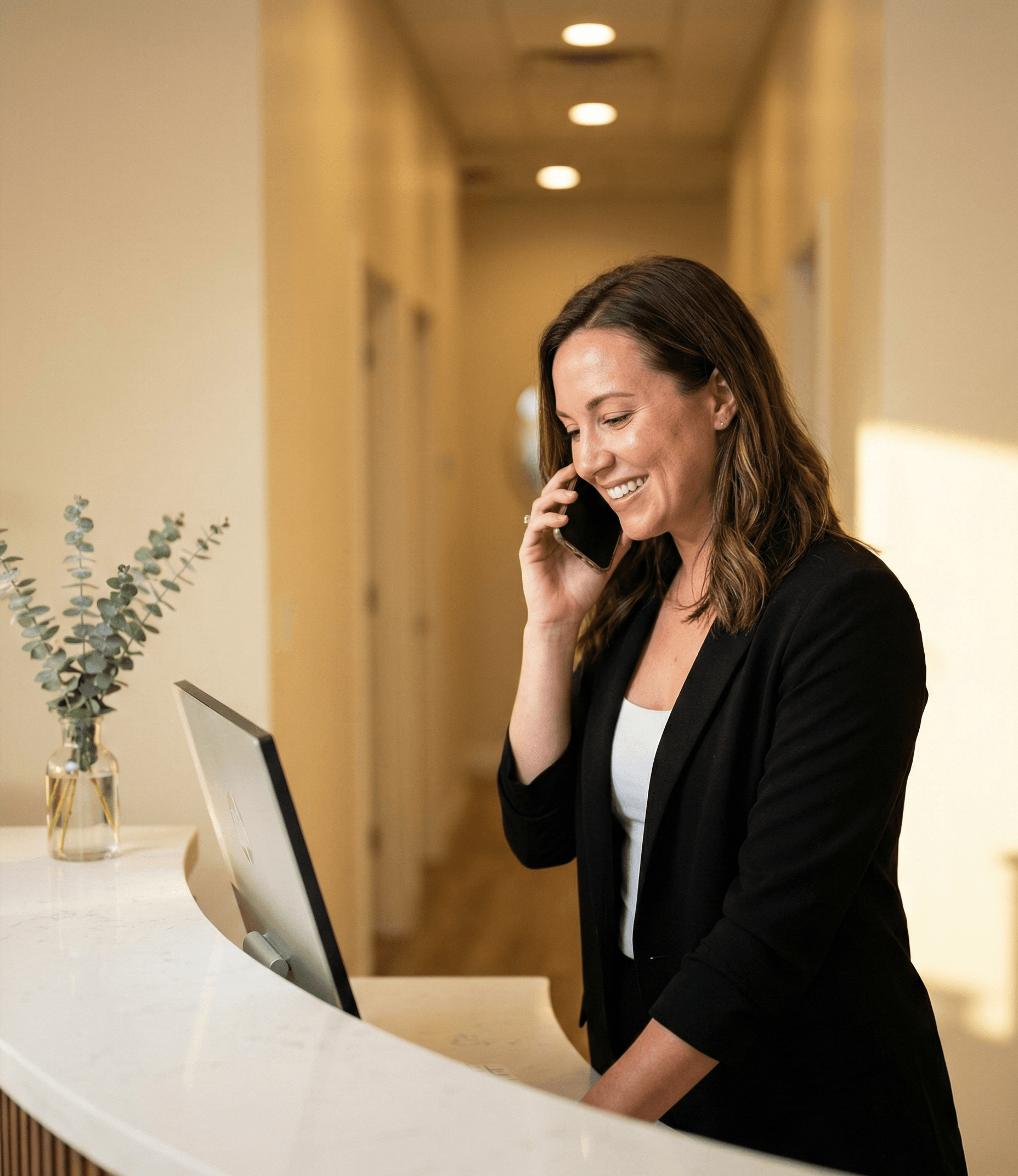 Med spa receptionist greeting a patient